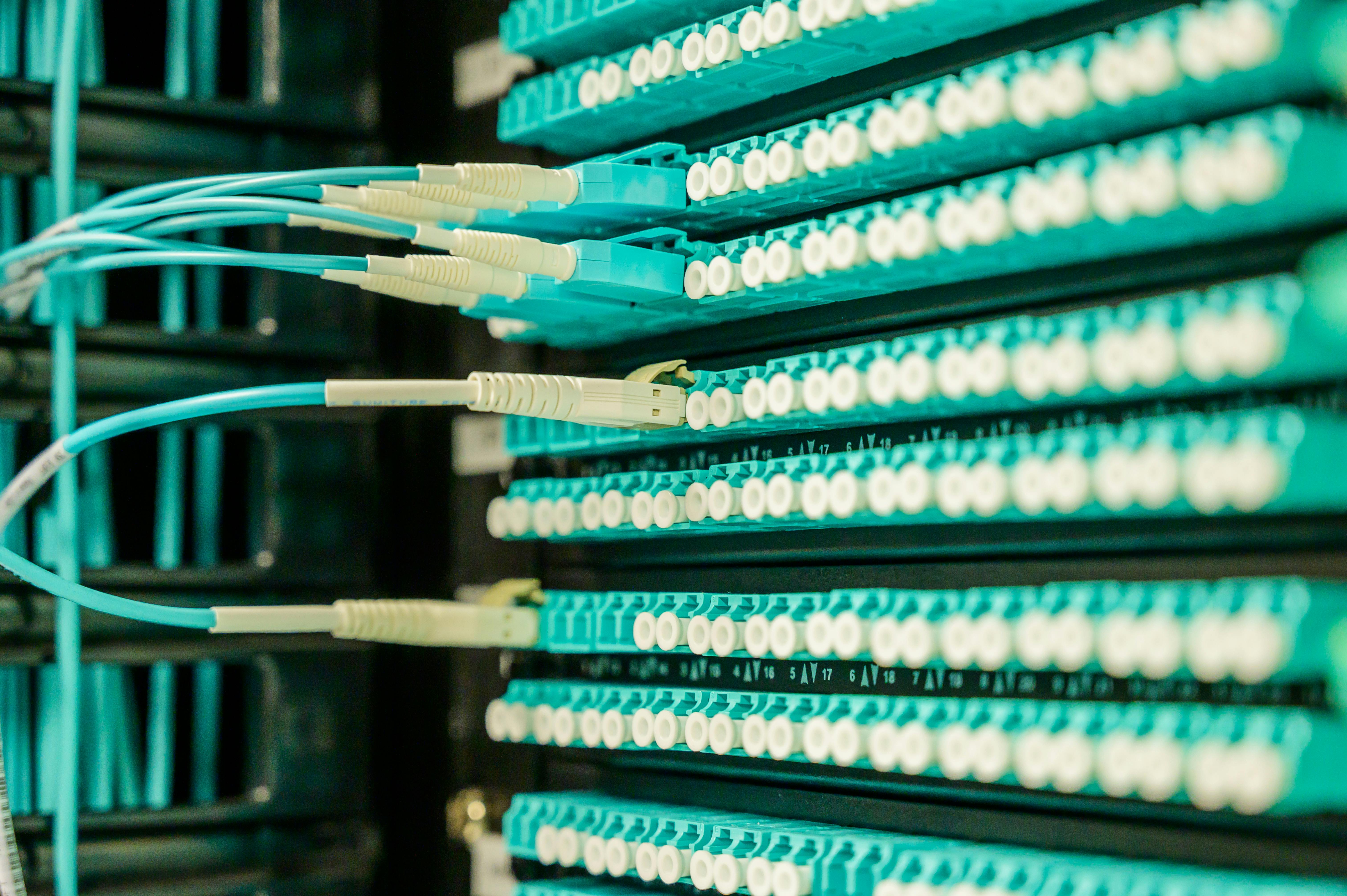 Engineers reviewing network design plans during real-world telecom deployment