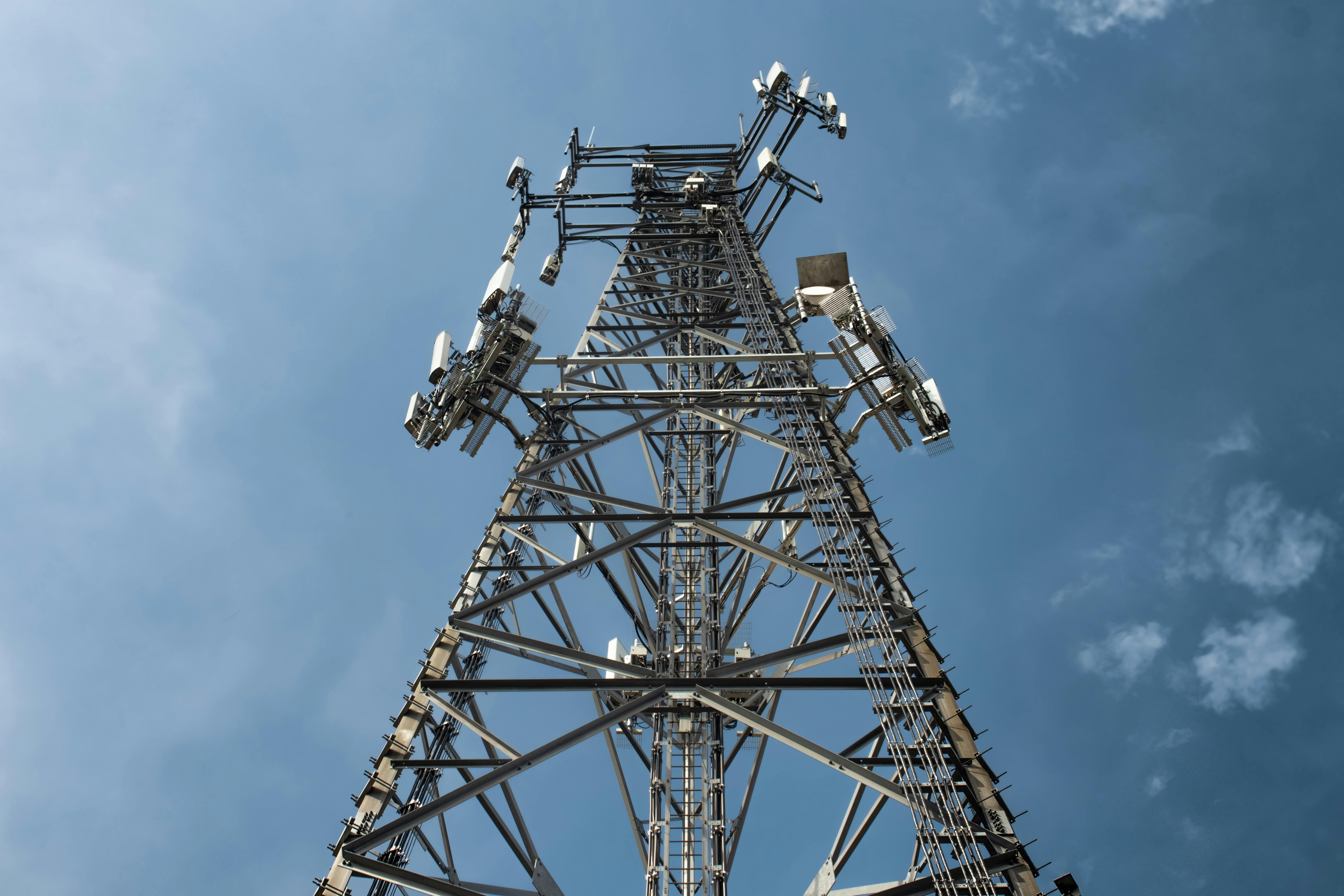 Telecom engineers managing 5G deployment and network installation across the UK