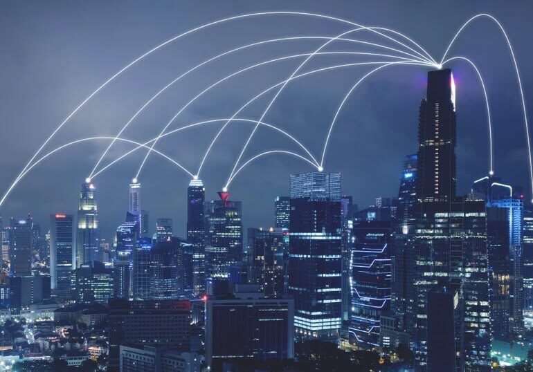 Engineers reviewing telecom infrastructure project plans before network deployment